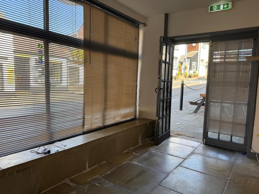 Lot: 54 - VILLAGE CENTRE COMMERCIAL PREMISES FOR INVESTMENT - View towards road from inside unit